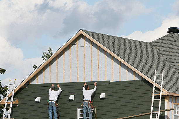 Professional Storm Damage Siding Repair technician working in Homeland, FL